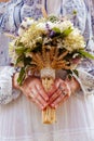 Stylish eclectic wedding bouquet in the bride hands