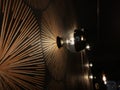 Stylish electric lamps hanging on an interior wall of a room