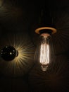 Stylish electric lamps with textures on an interior wall