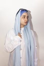 Stylish and elegant Muslim woman in traditional Islamic clothing. Portrait of beautiful Iranian girl in hijab and trendy Royalty Free Stock Photo