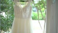 Stylish and elegant wedding dress hanging
