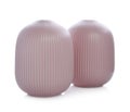 Stylish empty pink ceramic vases isolated