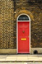 stylish entrance to a residential building, an interesting facade of the old brick arches above the door, a typical old English b