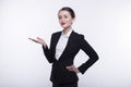 Stylish expressive young girl with long hair in a dark business suit and a white shirt