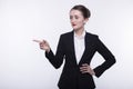 Stylish expressive young girl with long hair in a dark business suit and a white shirt