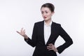 Stylish expressive young girl with long hair in a dark business suit and a white shirt