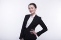 Stylish expressive young girl with long hair in a dark business suit and a white shirt