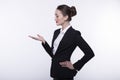 Stylish expressive young girl with long hair in a dark business suit and a white shirt