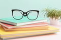 Stylish eyeglasses over pile of books. Studing, reading, optical store, eye test, vision examination at optician, fashion