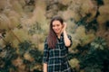 Stylish Fashion Girl with Plaid Shirt and Tassel Earrings Royalty Free Stock Photo