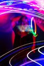 Stylish fashionable dancing blonde in the club neon light. Adult charming woman in modern music futuristic night club Royalty Free Stock Photo