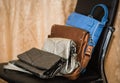 Stylish fashionable leather ladies purses lineup on black chair