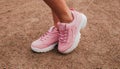 Stylish fashionable pink womens leather shoes. womens legs with sneakers