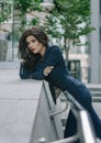 Stylish fashionable brunette in blue suit in the city. Fashion photo Royalty Free Stock Photo