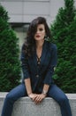 Stylish fashionable brunette in blue suit in the city. Fashion photo Royalty Free Stock Photo