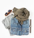 Stylish female clothes set. Woman/girl outfit on white background. Blue denim jacket, gray t-shirt, scarf, hand watch and retro su Royalty Free Stock Photo