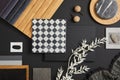 Stylish flat lay composition of creative architect moodboard with black, white, beige and grey samples of textile, paint.