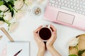 Stylish flatlay frame arrangement with pink laptop, tea, roses, glasses and other accessories on white