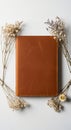 Rustic Brown Leather Notebook Dried Flowers Flatlay Photography Elegant Stationery Mockup AI generated. Royalty Free Stock Photo