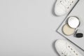 Stylish footwear and shoe care accessories on light grey background, flat lay. Space for text Royalty Free Stock Photo