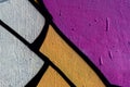 Stylish fragment of wall with detail of graffiti, street art. Abstract creative drawing fashion colors. Closeup painted