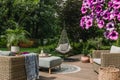 Stylish garden decoration with fancy egg chair and garden furniture