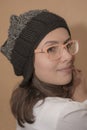 Stylish girl in knitted hat with funny glasses Royalty Free Stock Photo