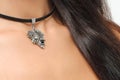 Stylish girl with long hair and neck with black choker bow accessory.