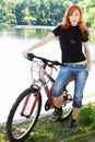 Stylish girl outdoors with her bicycle