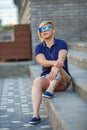 Stylish girl in sunglasses listens to headphones Royalty Free Stock Photo