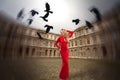 Stylish girl stands in the center of Paris, Royalty Free Stock Photo