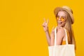 Stylish Girl In Straw Hat And Sunglasses Showing Peace Gesture Royalty Free Stock Photo