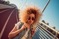 Stylish girl in sunglasses makes a kiss. Royalty Free Stock Photo