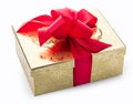 Stylish gold gift with a red decorative bow