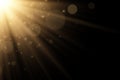 Stylish golden light effect isolated on a black background. Golden rays. Bright explosion. Flying magical dust. Sunlight. Abstract Royalty Free Stock Photo