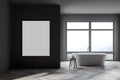 Stylish gray bathroom interior with tub, poster and windows Royalty Free Stock Photo