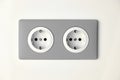 Stylish gray Electric Outlet. Power outlet on the wall. Euro type electric outlet on wall Royalty Free Stock Photo
