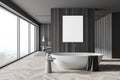 Stylish gray and wooden bathroom and bedroom interior with poster Royalty Free Stock Photo