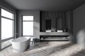 Stylish gray and wooden bathroom with tub and double sink, side view Royalty Free Stock Photo