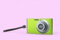 Stylish greeb compact pocket digital camera isolated on pink background Royalty Free Stock Photo