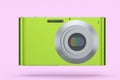 Stylish greeb compact pocket digital camera isolated on pink background Royalty Free Stock Photo