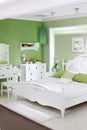 Stylish green bedroom with double bed Royalty Free Stock Photo