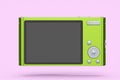 Stylish greeb compact pocket digital camera isolated on pink background Royalty Free Stock Photo