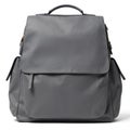 Stylish grey backpack with multiple pockets, sturdy straps. Features top handle, zipper closure, side pockets. Crafted from Royalty Free Stock Photo
