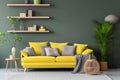 Stylish grey sofa with yellow pillows near green wall with wooden book shelf. Scandinavian interior design