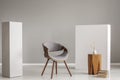 Stylish grey wooden chair in empty living room interior with wooden coffee table