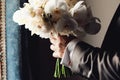 Stylish groom holding amazing bouquet of roses and golden leaves Royalty Free Stock Photo
