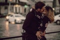 Stylish gypsy couple in love kissing in evening city street at m Royalty Free Stock Photo