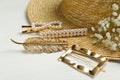 Stylish hair clips and hat on white table Royalty Free Stock Photo