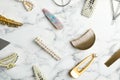 Stylish hair clips on white marble table Royalty Free Stock Photo